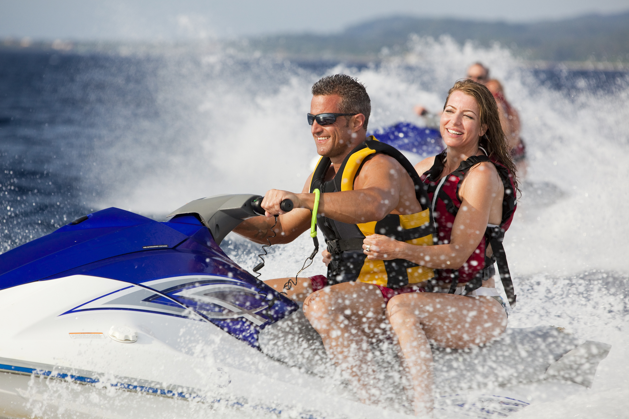 Couple riding a jet ski