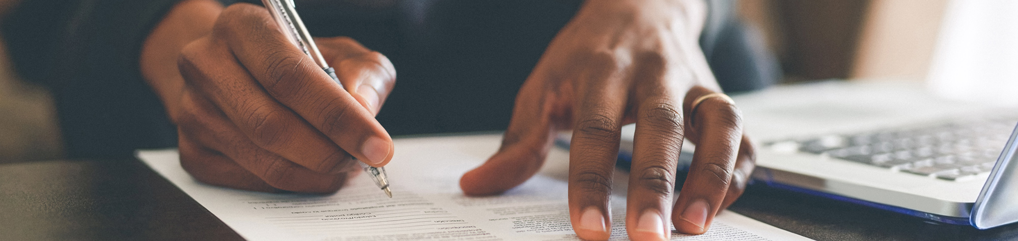 Man signing insurance documents