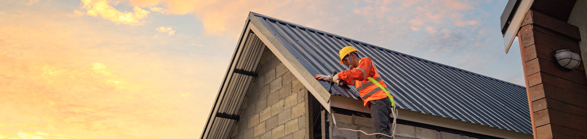 Construction worker fixing a roof