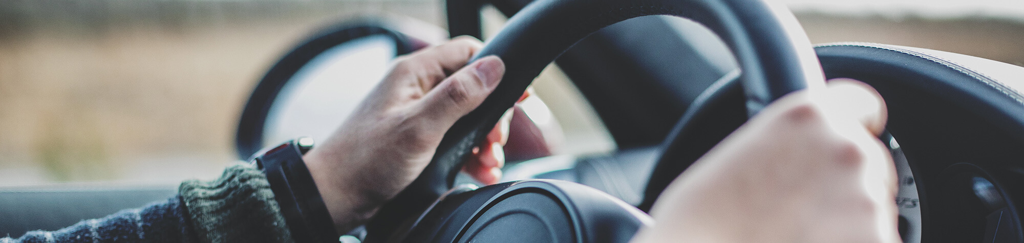 Hands on the steering wheel