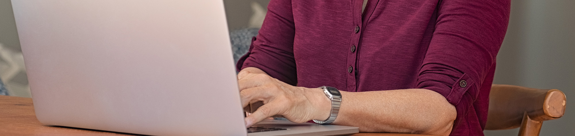 Woman typing on a computer