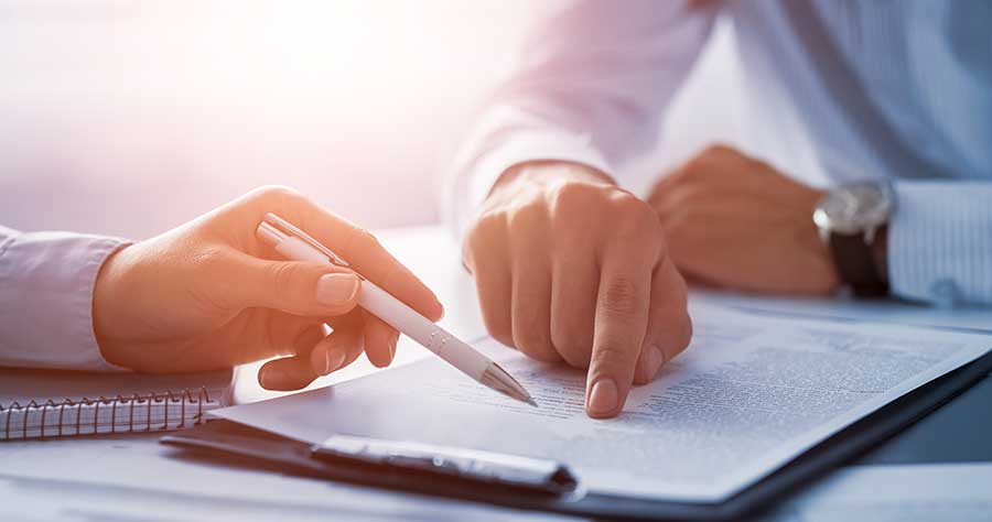 Business people reviewing documents