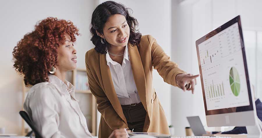 Business women reviewing data on a computer